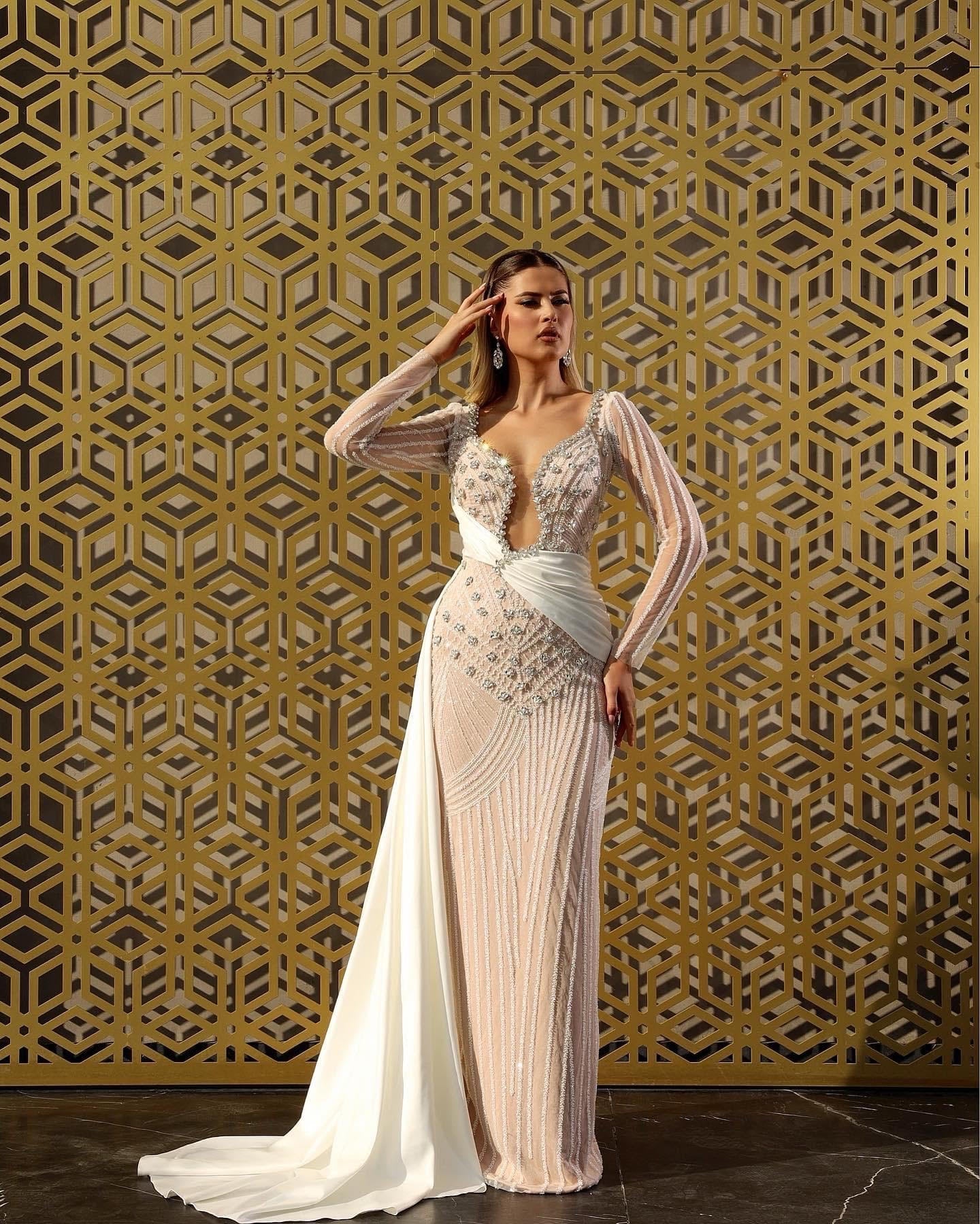 Cream wedding dress embellished with rhinestones and draping